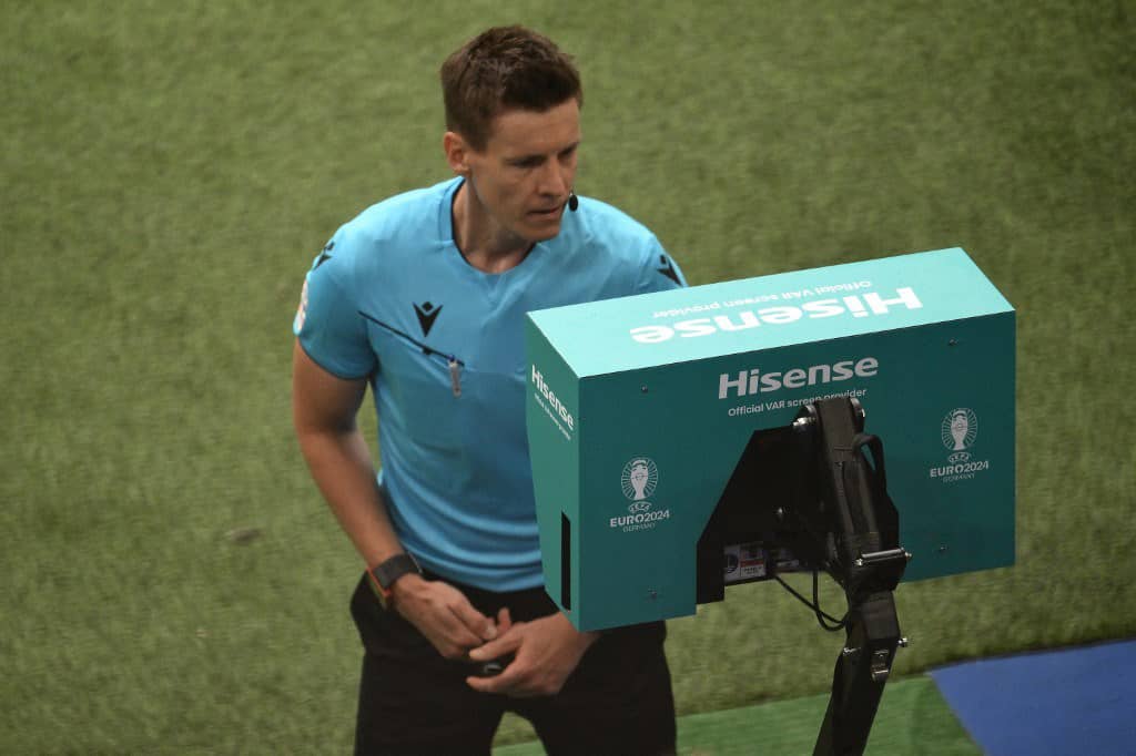 GERMAN referee Daniel Siebert consults the pitch-side VAR monitor during the UEFA Euro 2024 Group F football match between Georgia and the Czech Republic.